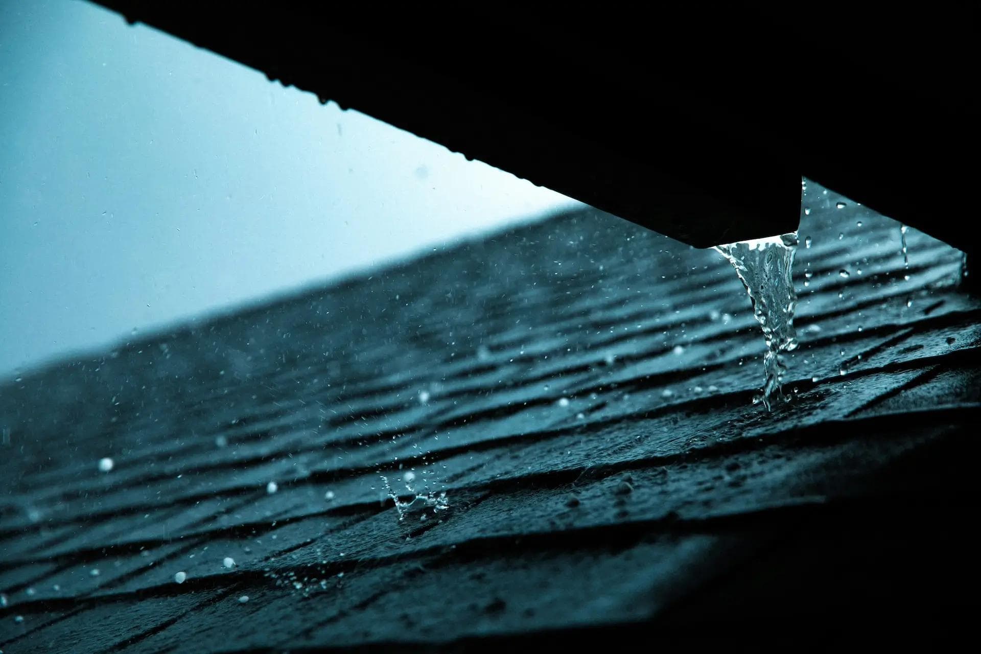 Hail hitting a residential roof.