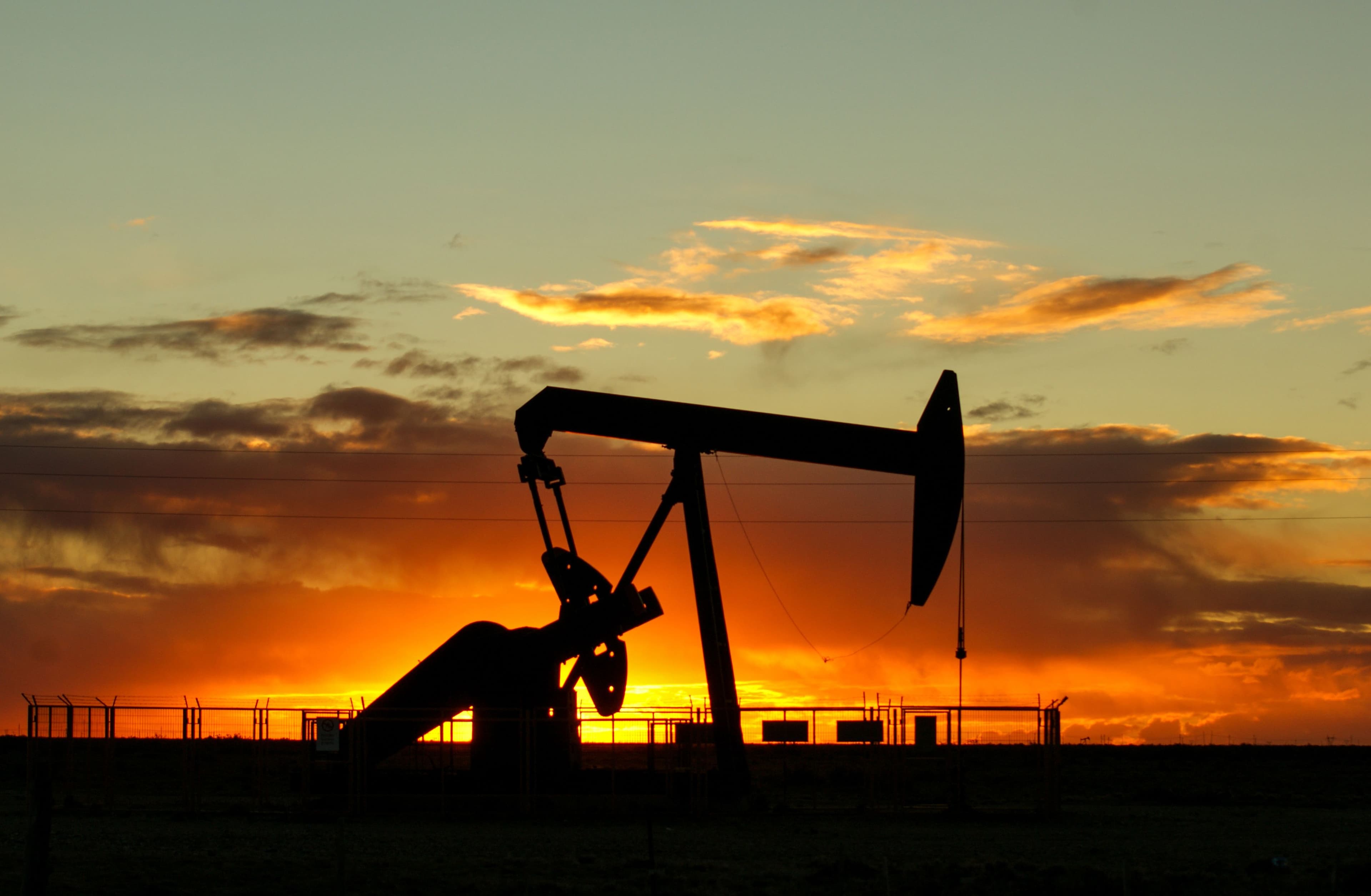 Pumpjack in field at sunset in Aledo Texas