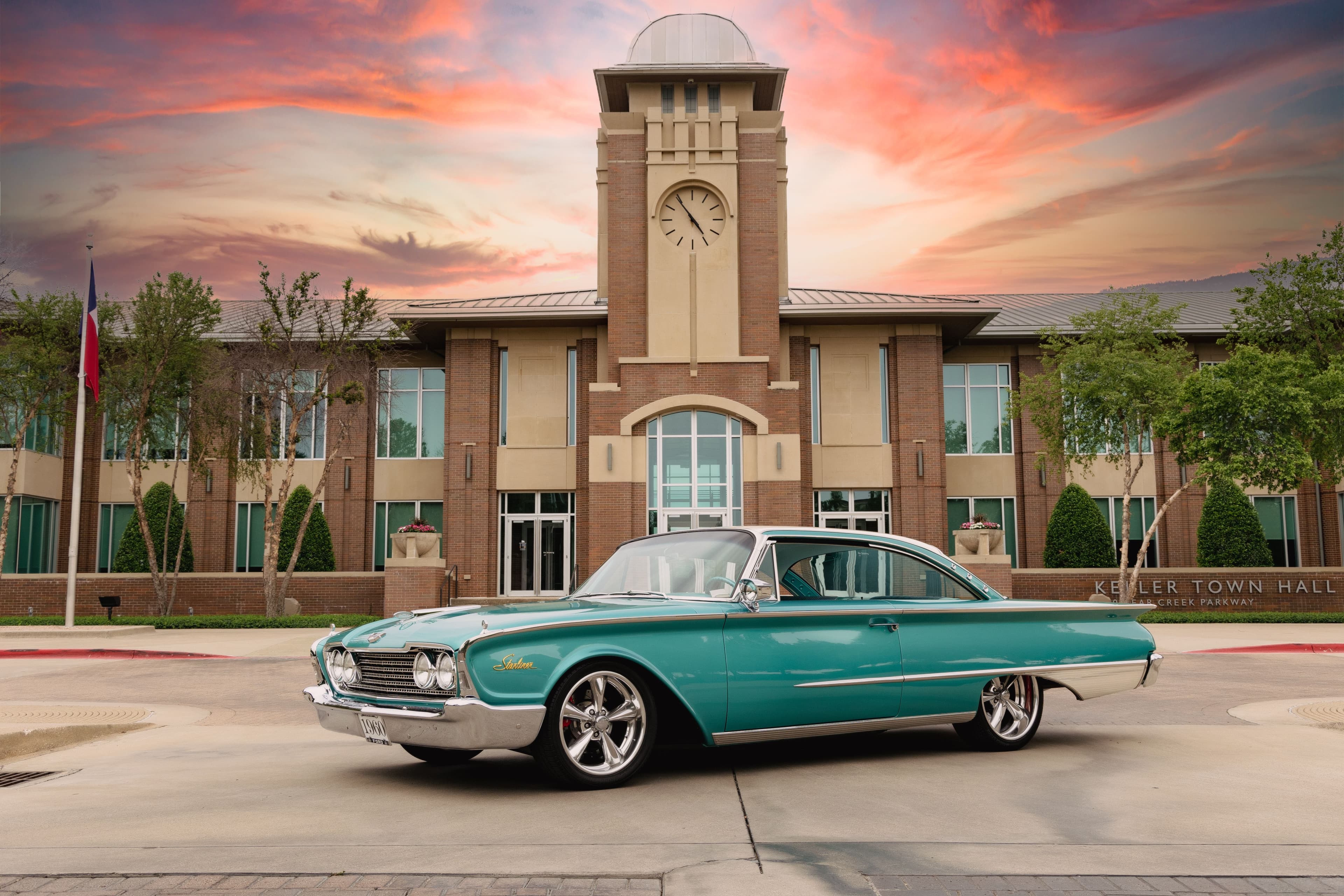 Keller Town Hall with classic car at sunset