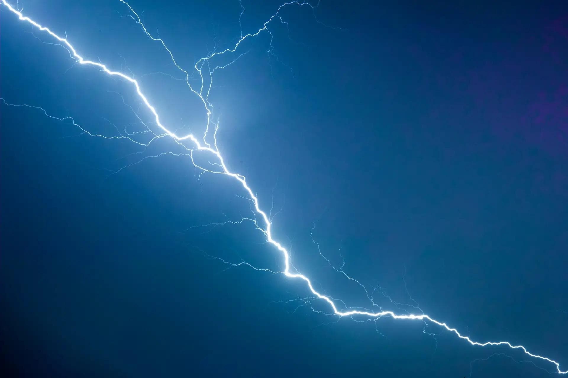 Lightning strike in a dark night sky.