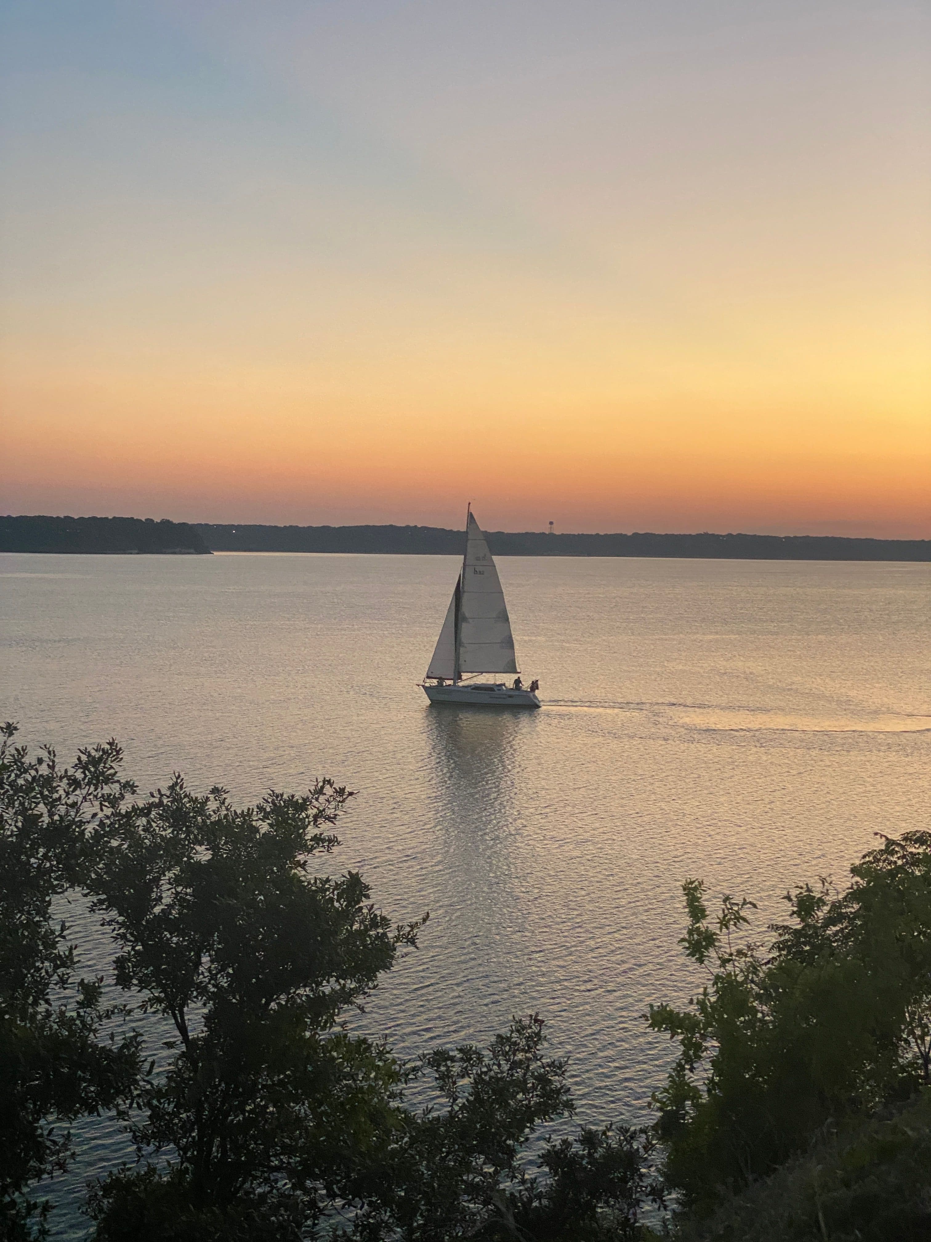 Eagle Mountain Lake with a sailboat at sunset